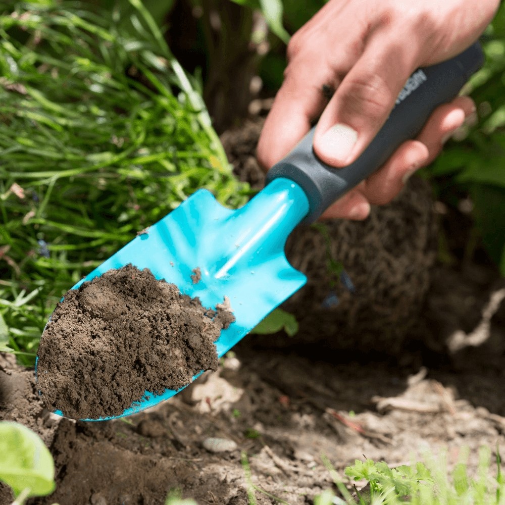 Narrow Hand Trowel Digging Dirt